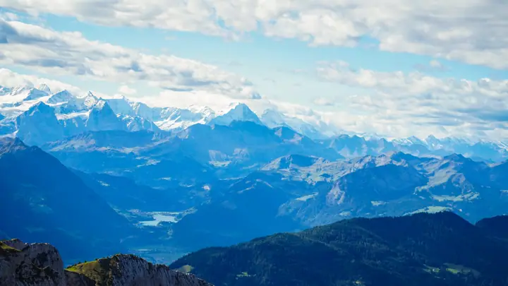 Snow-capped mountain range under a blue sky